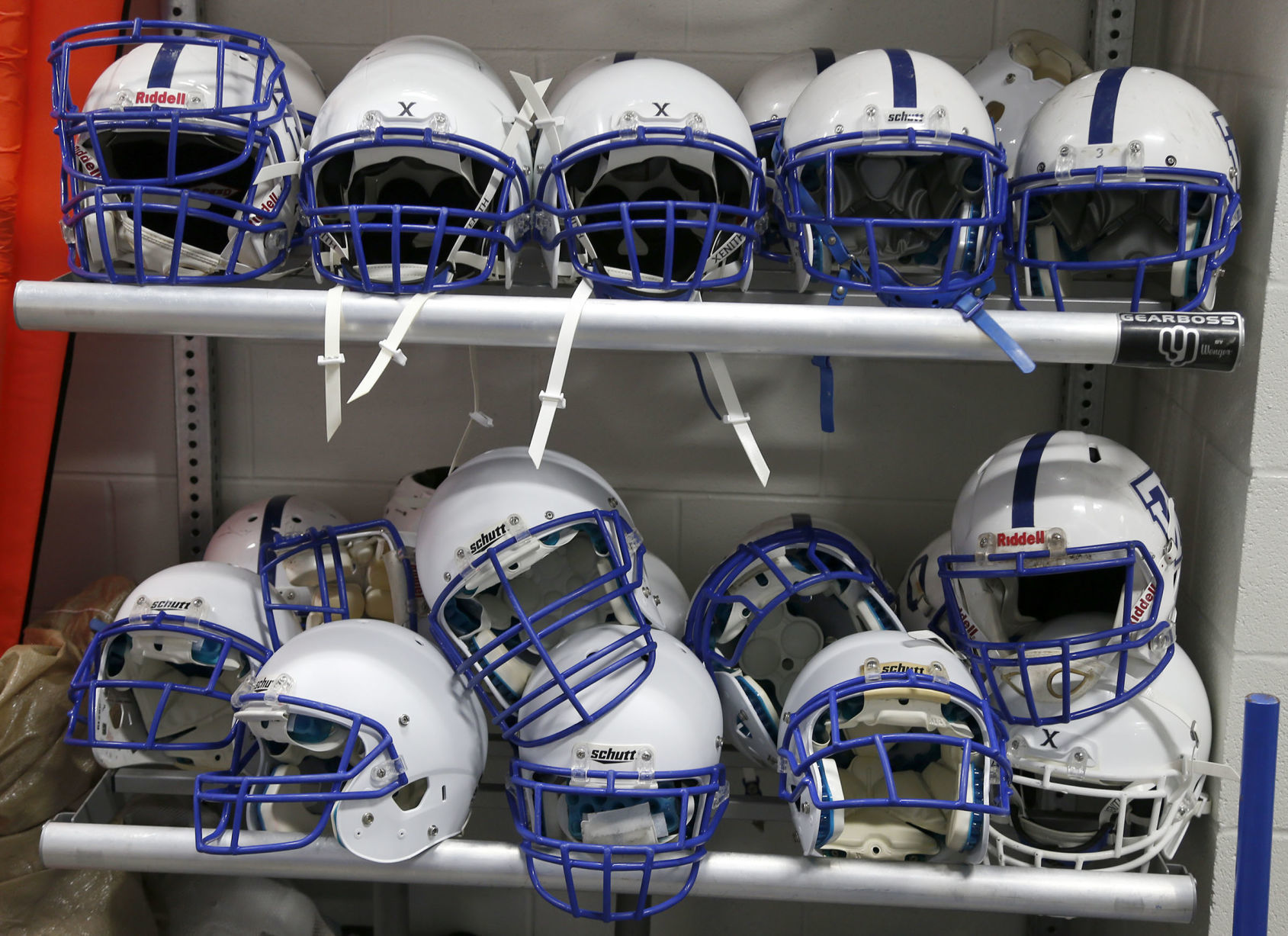 ‘We just don’t have it’: On matter of helmet safety, money separates local football programs